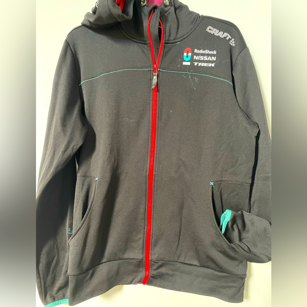 Biker’s Craft brand hooded jacket with sponsor names.